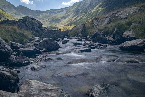 romanian countryside view of river and mountains