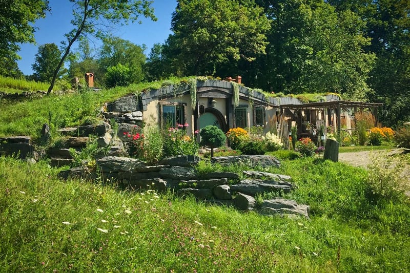 A Hobbit Hole Tucked In A Vermont Grassy Hillside